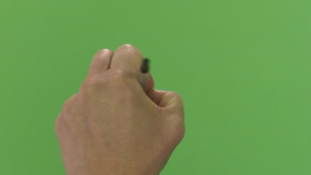 Green screen shot of a male white hand, writing with a pen