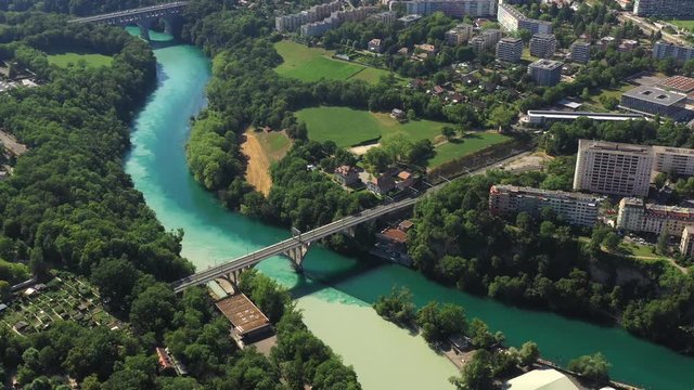 Aerial drone flight over Rhone and Arve confluence and city view and nature, Geneva, Switzerland, 4k