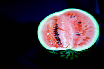 slice of watermelon on black background