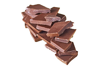 Stack of pieces of broken bar dark bitter or milky chocolate isolated on white background without...
