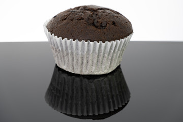 Delicious of chocolate chip cupcake isolated on black background