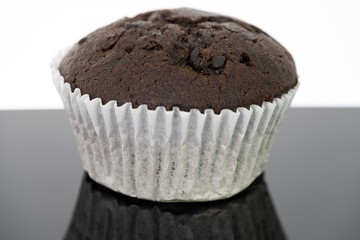 Delicious of chocolate chip cupcake isolated on black background