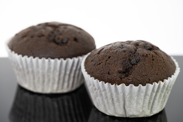 Delicious of chocolate chip cupcake isolated on black background