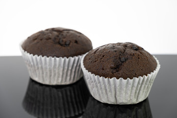 Delicious of chocolate chip cupcake isolated on black background