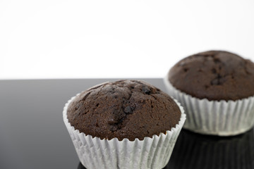 Delicious of chocolate chip cupcake isolated on black background