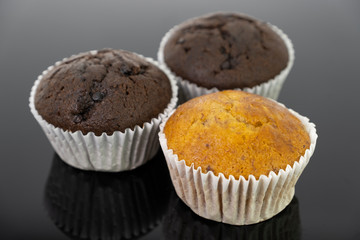 Delicious of banana and chocolate chip cupcake isolated on black background