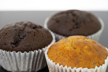 Delicious of banana and chocolate chip cupcake isolated on black background