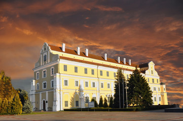 The Jesuit College in the ancient city of Pinsk against a red sky.