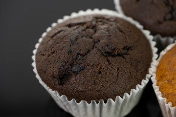 Delicious of chocolate chip cupcake isolated on black background