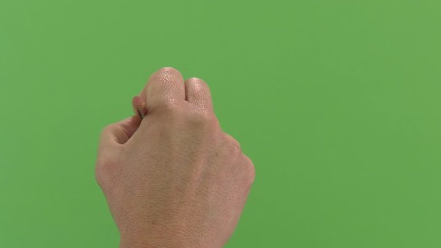 Green screen shot of a white male hand writing right handed