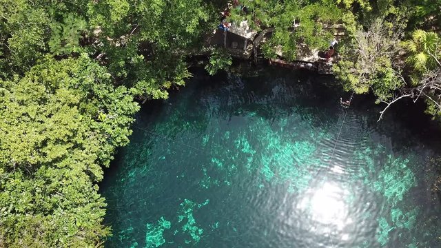 Mexican Cenote, Natural Pool in The Middle of Jungle. Top Down Bird Eye Aerial View. Tulum Mexico