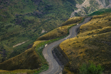 Fototapeta premium Road snaking through mountain landscape