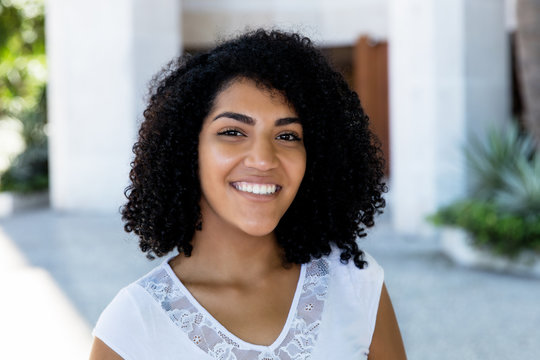 Portrait Of Laughing Mexican Young Adult Woman With Black Hair