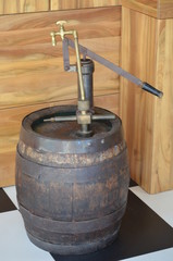 old wooden barrel of red wine