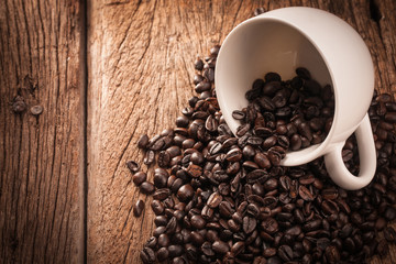 coffee beans and coffee cup on wood table