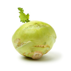 Fresh kohlrabi with green leaves on isolated white backround