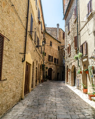 Fototapeta na wymiar Old Stone Buildings on Alleys in Tuscany Italy