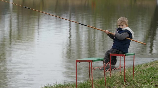 Small child learns to fish