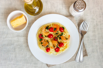 Italian pasta spaghetti with shrimps and tomatoes. National cuisine.