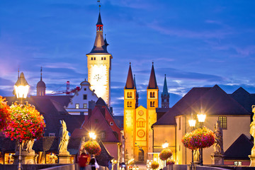 Old Main Bridge over the Main river and scenic towers in the Old Town of Wurzburg dawn view
