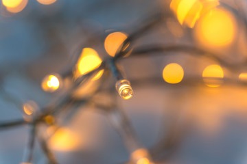 christmas, holidays and illumination concept - close up of electric garland lights
