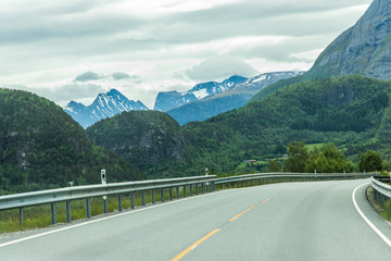 Scenic country road and beautiful mountains in Norway