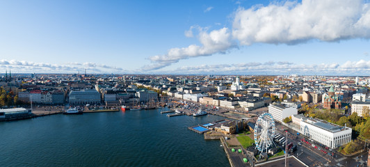 Aerial panorama of the Market Square at the Old Town pier in Helsinki, Finland. Beautiful blue sky and clouds.