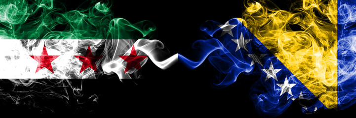 Syrian Arab Republic vs Bosnia and Herzegovina, Bosnian smoke flags placed side by side. Thick colored silky smoke flags of Syria opposition and Bosnia and Herzegovina, Bosnian