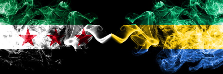 Syrian Arab Republic vs Gabon, Gabonese smoke flags placed side by side. Thick colored silky smoke...