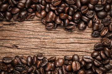Coffee beans on wood background