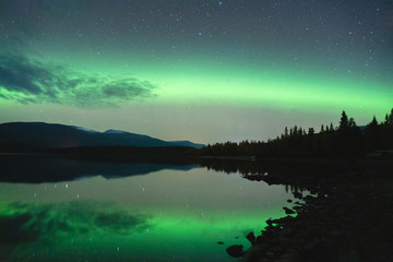 Northern lights reflecting in a lake