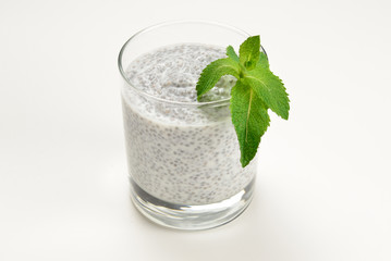 Chia pudding with mint on a white background. Space for text or design.
