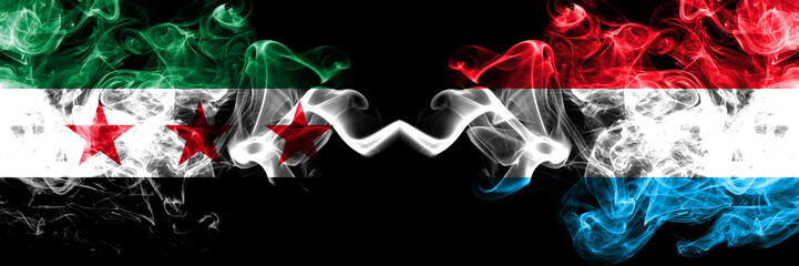 Syrian Arab Republic vs Luxembourg smoke flags placed side by side. Thick colored silky smoke flags...