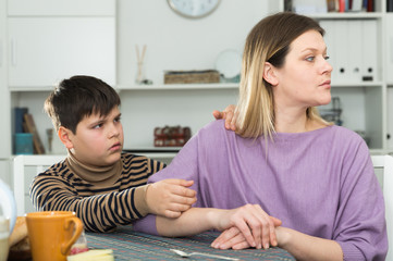 Small boy wants to make peace with his mother after  arguing at table