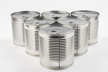 Group of silver canned food on white background.