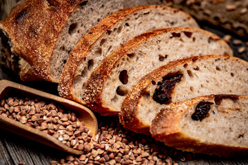 Freshly baked traditional bread on wooden table.