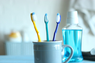 Toothbrushes and oral cleaners on the table.