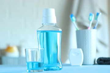 mouthwash on the table. Products to maintain oral cleanliness.
