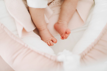 Obraz na płótnie Canvas Newborn baby feet closeup. Happy Family concept. conceptual image of Maternity