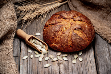 Pumpkin bread. Freshly baked traditional bread on wooden table.