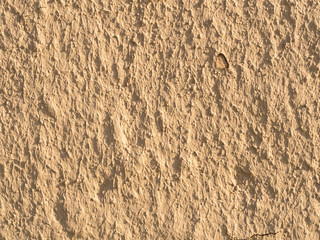 texture of a clay wall form a mud house