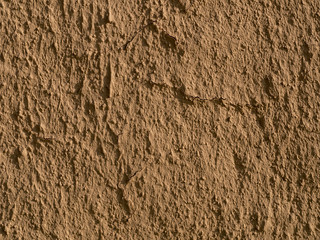 texture of a clay wall form a mud house