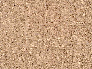 texture of a clay wall form a mud house