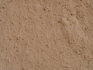 texture of a clay wall form a mud house