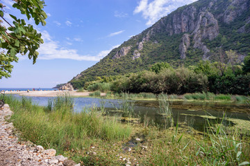 River through Olympos antique city ruins. Kemer, Antalya, Turkey.