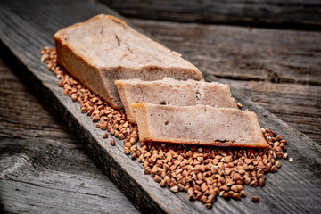 Buckwheat bread. Freshly baked traditional bread on wooden table.