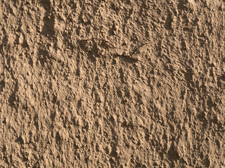 texture of a clay wall form a mud house