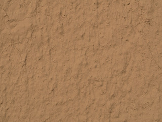 texture of a clay wall form a mud house