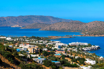 Fototapeta na wymiar Beautiful view of the Bay of Elounda.The worldwide famous resort with luxurious hotels and the historic island of Spinalonga.