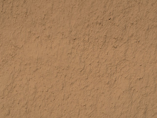 texture of a clay wall form a mud house